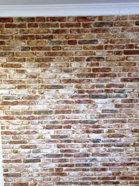 облицовка стен камнем с имитацией кирпичной кладки